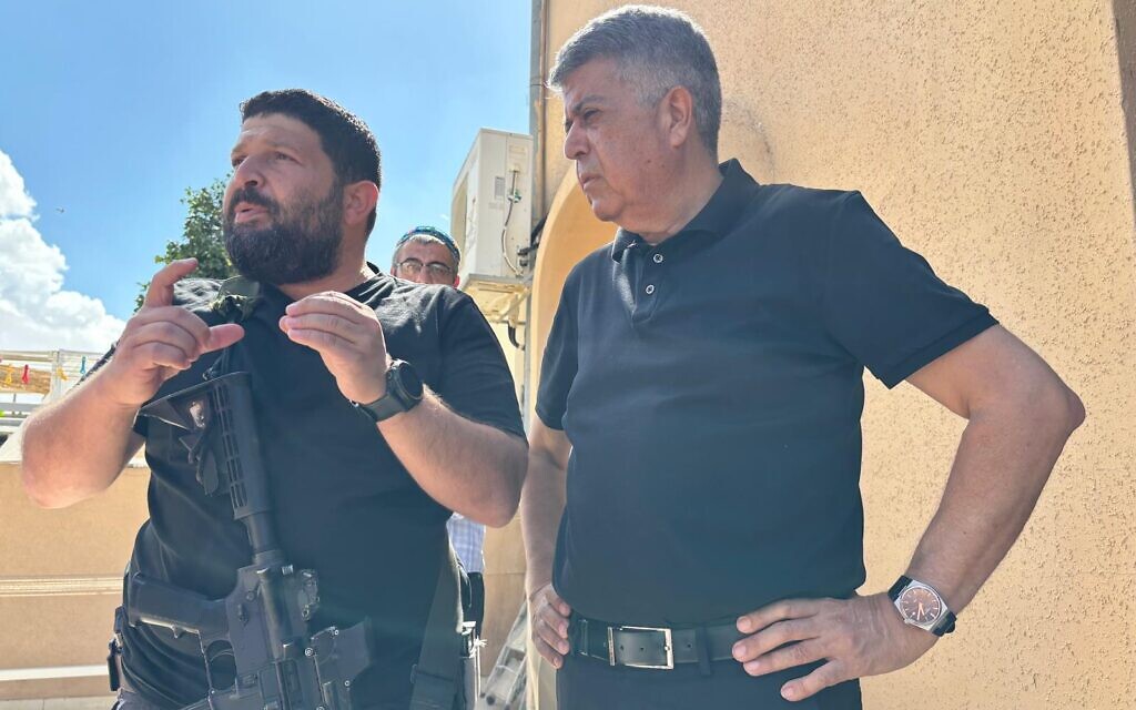 MK Almog Cohen (L) and Ofakim Mayor Itzik Danino discuss their experiences during Hamas' October 7 attack in the city, October 15, 2023 (Carrie Keller-Lynn/Times of Israel)
