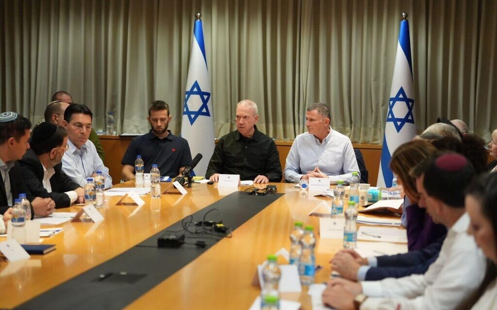Defense Minister Yoav Gallant, center, speaks at a Knesset Foreign Affairs and Defense Committee meeting in Tel Aviv, October 20, 2023. (Elad Malka/Defense Ministry)
