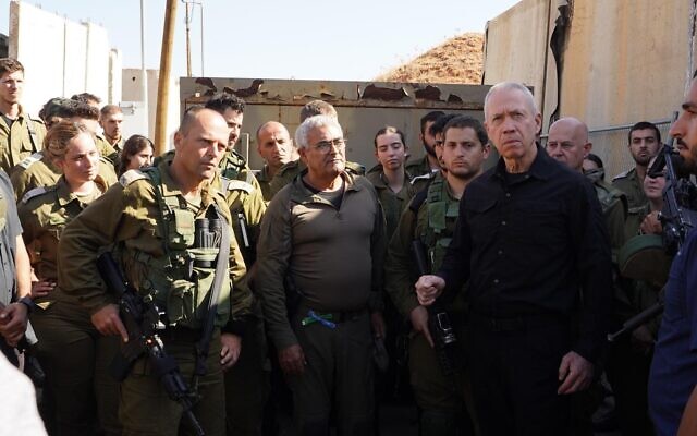 Defense Minister Yoav Gallant speaks to soldiers at the Biranit camp on the Lebanon border, October 21, 2023. (Ariel Hermoni/Defense Ministry)