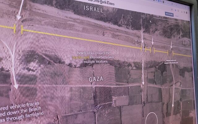 A computer screen shows an image of a New York Times analysis of satellite imagery of Gaza on October 31, 2023. (Times of Israel)