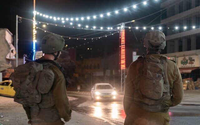 In this handout photo from the military, Israeli troops are seen in the Palestinian town of Huwara in the northern West Bank, October 6, 2023. (Israel Defense Forces)