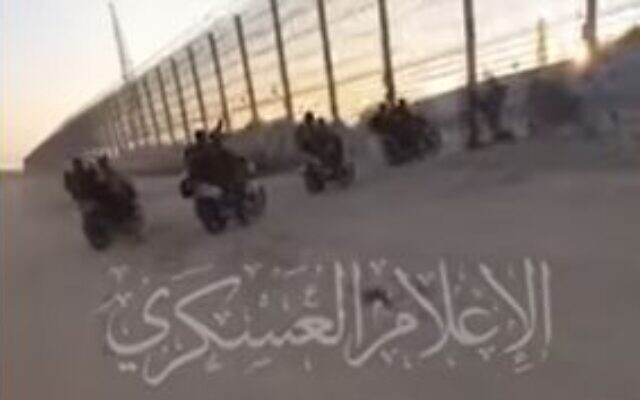 A Hamas video shows Hamas terrorists on motorbikes crossing the breached fence from Gaza into Israel on October 7, 2023. (Youtube screenshot)