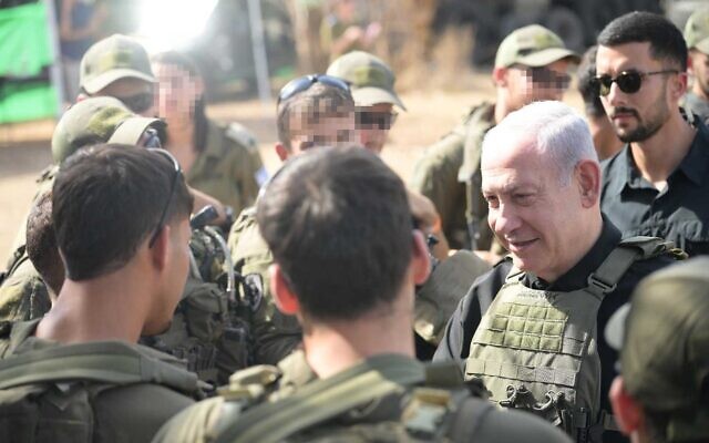 Prime Minister Benjamin Netanyahu meets with troops on October 22, 2023 (Amos Ben-Gershom/GPO)