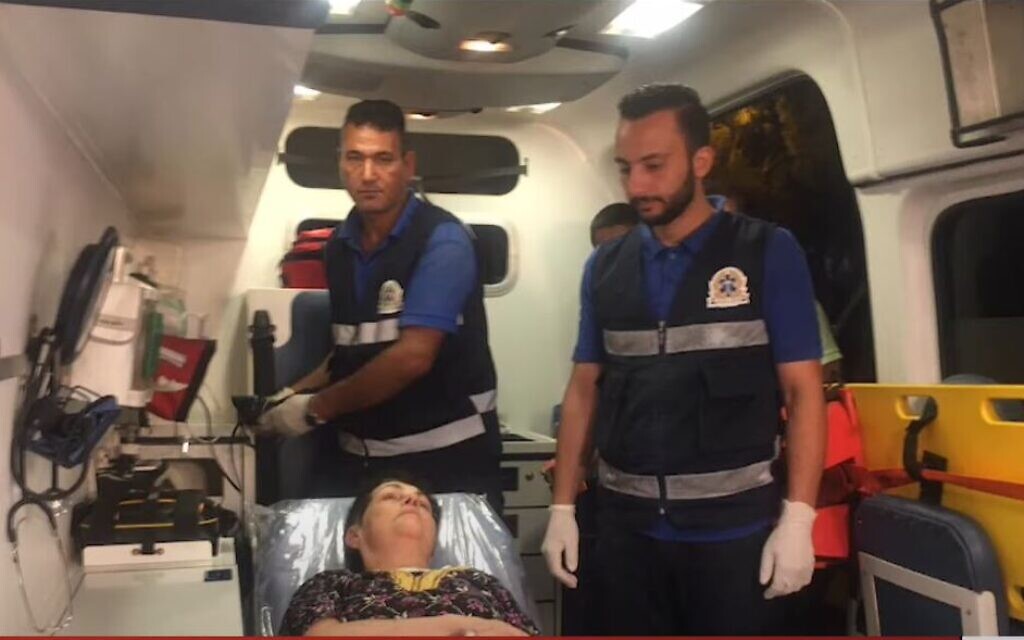 Nurit Cooper in an ambulance after her release from Hamas captivity on October 23, 2023. (screen capture)