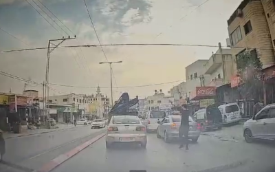 Dashcam footage shows a Palestinian terrorist opening fire at close range at an Israeli car in the West Bank town of Huwara, October 5, 2023. (Courtesy)