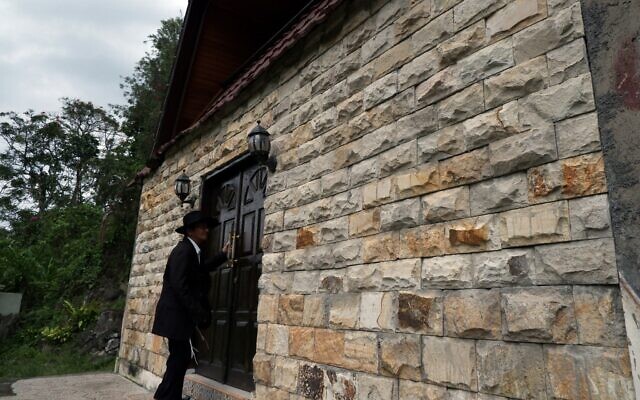 An Indonesian Jew enters the synagogue in Tondano, North Sulawesi, March 4, 2019. (Photo by Ronny Adolof Buol / AFP)