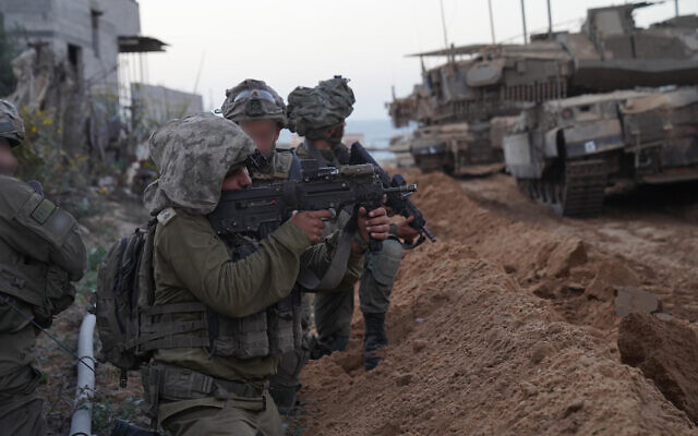 Soldiers seen during a ground operation in the Gaza Strip, in a handout photo published November 10, 2023. (Israel Defense Forces)