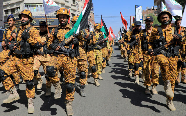Armed forces loyal to Yemen's Houthi rebels march through the streets of Sanaa in a show of solidarity with the Palestinians on October 15, 2023. (Mohammed Huwais/AFP)