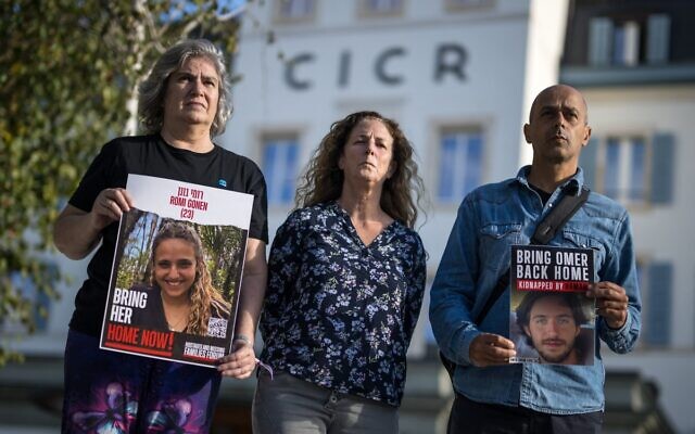 Relatives of Israelis missing or held hostages by Hamas pose after a meeting at the International Committee of the Red Cross (ICRC) headquarters in Geneva on October 20, 2023. (Fabrice COFFRINI / AFP)