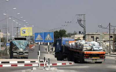 Trucks carrying humanitarian aid enter the southern Gaza Strip from Egypt via the Rafah border crossing on November 2, 2023. (MOHAMMED ABED/AFP)