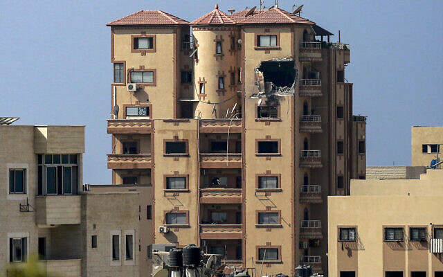 This picture taken on November 3, 2023 shows a gaping hole following a strike on the Hajji building, which houses several offices including those of Agence France Presse (AFP) in Gaza City amid the ongoing battles between Israel and the Palestinian group Hamas. (Bashar TALEB / AFP)