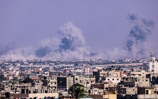 Huge plums of smoke rise over the city of Khan Younis, as seen from the city of Rafah in the southern Gaza Strip on November 4, 2023, amid the ongoing war between Israel and the Palestinian terror group Hamas. (Said Khatib/AFP)