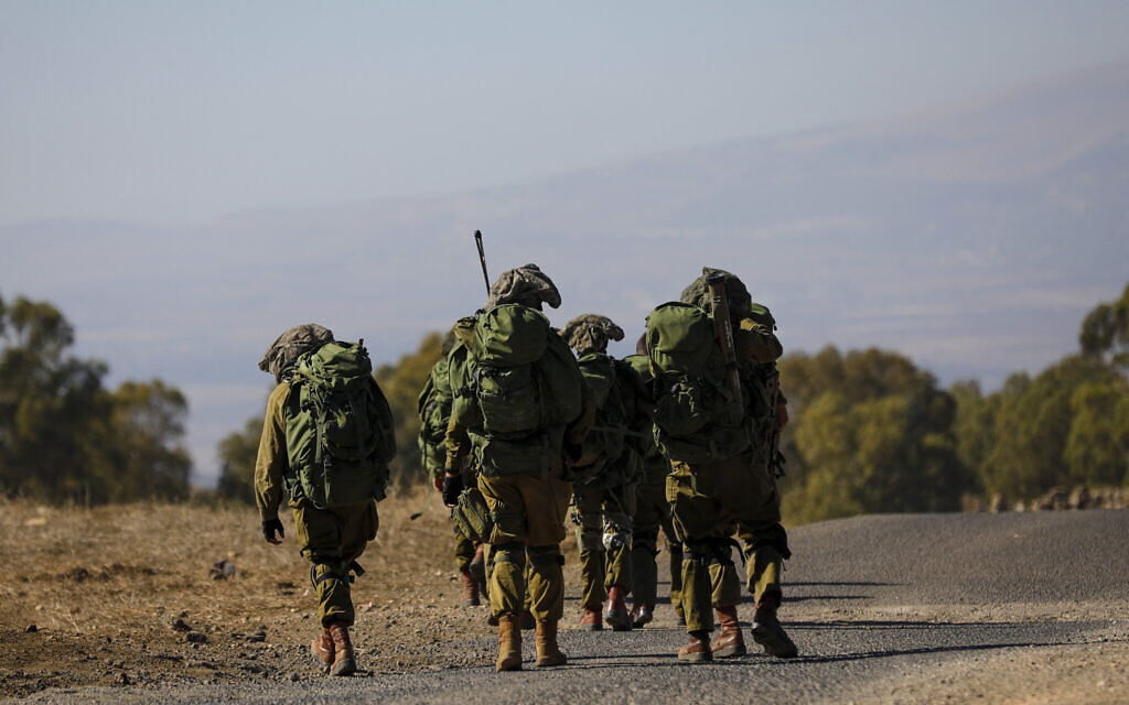 Israeli soldiers arrive for a drill in the Golan Heights on November 9, 2023, amid increasing cross-border tensions between Hezbollah and Israel as fighting continues in the south with Hamas terrorists in the Gaza Strip (Jalaa MAREY / AFP)