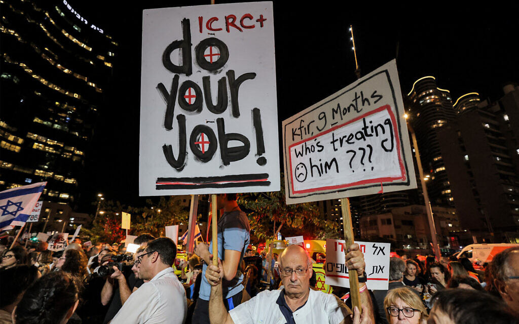 Demonstrators calling upon the International Committee of the Red Cross (ICRC) to take action for the release of hostages abducted by Hamas on October 7 and currently held in the Gaza Strip, outside the ICRC offices in Tel Aviv on November 9, 2023. (AHMAD GHARABLI / AFP)