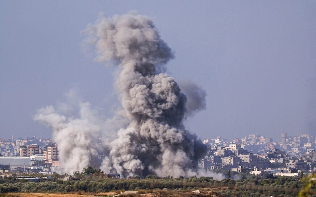 This picture taken from the Israeli side of the border with the Gaza Strip on November 10, 2023 shows billowing smoke following an Israeli strike in the Gaza Strip (Photo by KENZO TRIBOUILLARD / AFP)