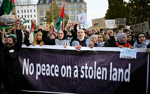 File: Demonstrators display a banner with the lettering "No peace on a stolen land" as they take part in a rally in solidarity with Palestinians and against Israel at Oranienplatz Square in Berlin's Kreuzberg district, Germany, on November 11, 2023. (Tobias SCHWARZ / AFP)