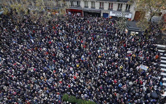 A photograph shows protesters marching against antisemitism in a Paris street on November 12, 2023. (Geoffroy VAN DER HASSELT / AFP)