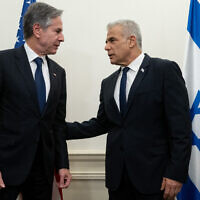 Opposition Leader Yair Lapid (R) and US Secretary of State Antony Blinken meet in Tel Aviv on November 30, 2023. (Saul Loeb/Pool/AFP)