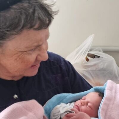 Marcelle Taljah, seen with her new granddaughter on October 6, a day before she was murdered. (Courtesy)