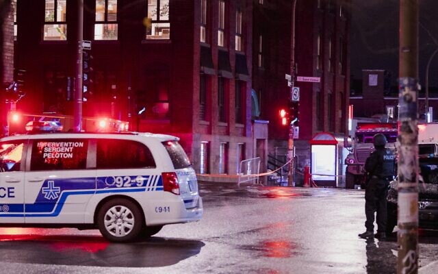 Illustrative: Montreal police at a crime scene in Montreal, Quebec on November 13, 2020. (Andrej Ivanov / AFP)