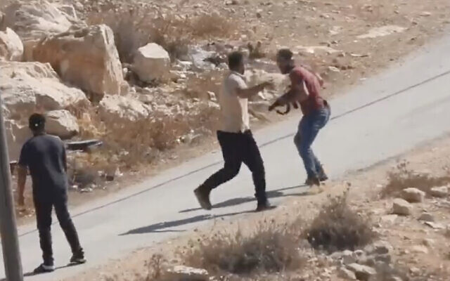 An Israeli settler attacks and shoots an unarmed Palestinian man at point blank range during an incident in the Palestinian village of A-Tuwani village in the South Hebron Hills, October 13, 2023. (Screenshot courtesy of B'tselem, used in accordance with Clause 27a of the Copyright Law)