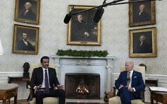Qatar's Emir Sheikh Tamim bin Hamad Al Thani, left, speaks during a meeting with US President Joe Biden in the Oval Office of the White House, Monday, Jan. 31, 2022, in Washington. (AP Photo/Alex Brandon)