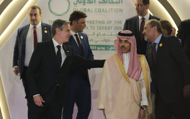 Saudi Foreign Minister Prince Faisal bin Farhan, second right, Jordan's Foreign Minister Ayman Safadi, right, and the US Secretary of State Antony Blinken, front left, attend the Ministerial meeting for the Global Coalition to Defeat ISIS, on the sidelines of a family photo session, at the Intercontinental Hotel in Riyadh, Saudi Arabia, Thursday, June 8, 2023. (Ahmed Yosri/Pool Photo via AP)
