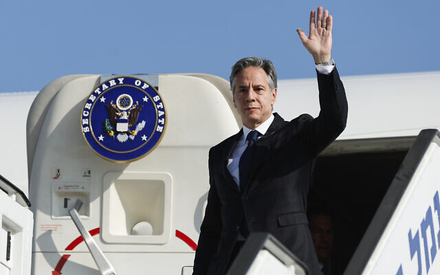 US Secretary of State Antony Blinken waves as he disembarks from an aircraft on his arrival at Ben Gurion Airport, November 3, 2023. (Jonathan Ernst/Pool Photo via AP)