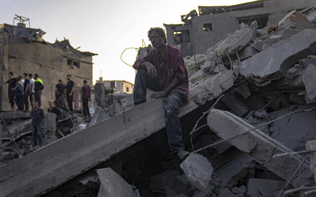 Palestinians look for survivors of an Israeli bombing in Maghazi, Gaza Strip, Nov. 5, 2023. (AP Photo/Fatima Shbair)