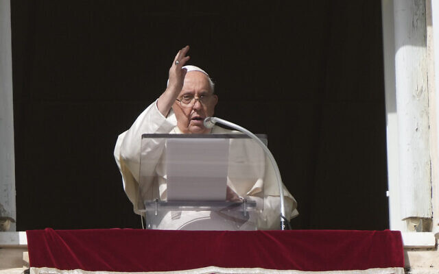 Pope Francis delivers a blessing during the Angelus noon prayer in St. Peter's Square at the Vatican, Sunday, Nov. 5, 2023. (AP Photo/Gregorio Borgia)