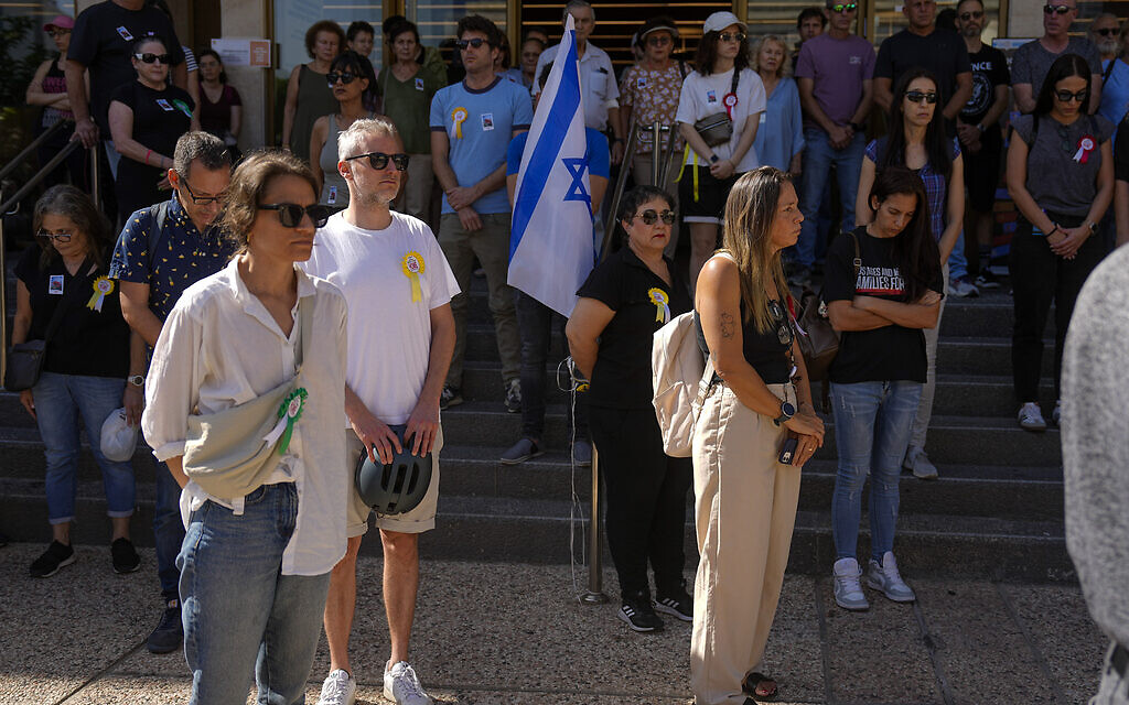 Israelis stand still for a minute of silence in memory of the victims of Hamas's October 7 brutal cross-border attack in Tel Aviv, November 7, 2023. (AP/Ariel Schalit)