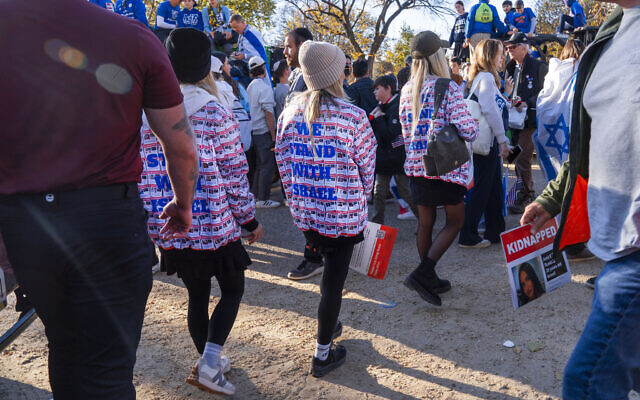 Women wearing jackets with the faces of people who were kidnapped by Hamas, attend the March for Israel rally, Nov. 14, 2023, on the National Mall in Washington. (AP Photo/Jacquelyn Martin)