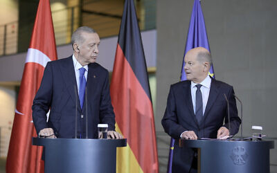 Turkey's President Recep Tayyip Erdogan, left, and German Chancellor Olaf Scholz talk to the media at a press conference at the chancellery in Berlin, Germany, Friday, Nov. 17, 2023. (AP Photo/Markus Schreiber)