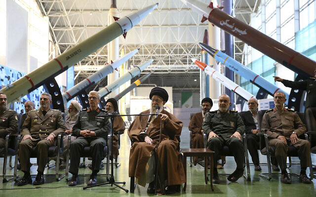 Iranian supreme leader Supreme Leader Ayatollah Ali Khamenei, center, visits an exhibition of the Revolutionary Guard's aerospace achievements, November 19, 2023. (Office of the Iranian Supreme Leader via AP)