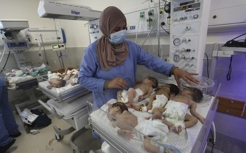 A nurse cares for prematurely born Palestinian babies that were brought from Shifa Hospital in Gaza City to the hospital in Rafah, Gaza Strip, Nov. 19, 2023. (AP Photo/Hatem Ali)