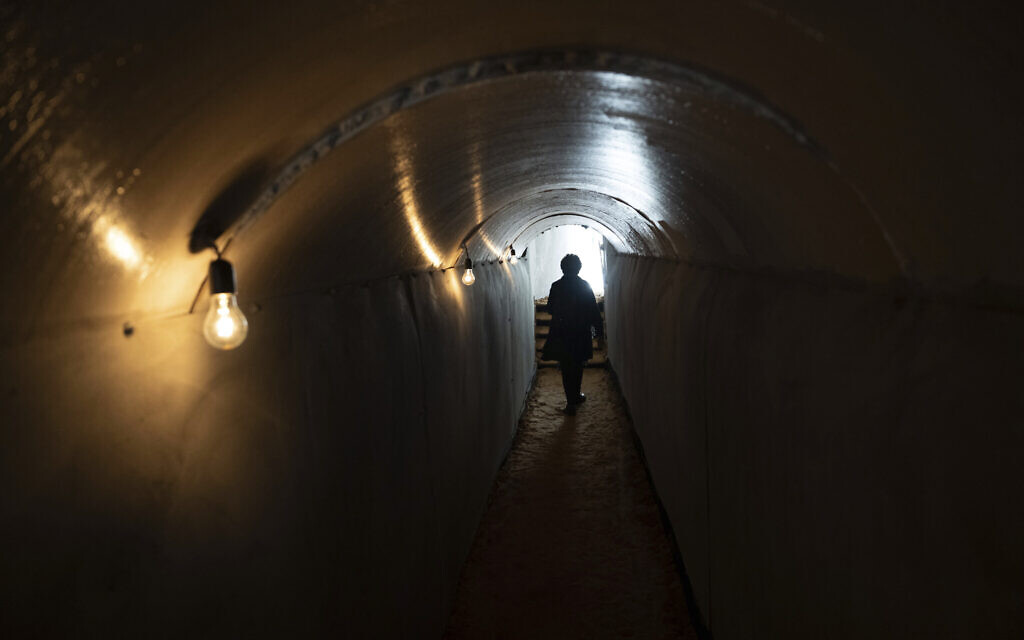 People walk through an installation simulating a tunnel in Gaza in an act of solidarity with hostages believed to be held underground by Hamas and calling for their return, in Tel Aviv, Israel, Wednesday, Nov. 22, 2023. Hamas and other terrorists abducted some 240 people, mostly Israeli civilians, during an Oct. 7 cross-border attack that triggered the latest war between Israel and the Islamic terror group. The two enemies have agreed to a cease-fire that is to include the release of 50 hostages in the coming days. (AP Photo/Oded Balilty)