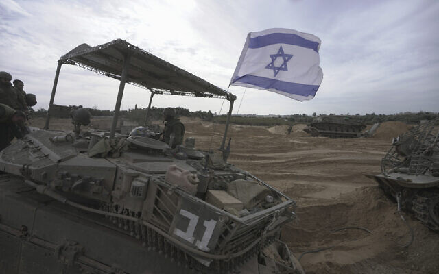 Israeli soldiers are seen during a ground operation in the Gaza Strip, Wednesday, Nov. 22, 2023. (AP/Victor R. Caivano)