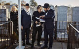 Argentina's president-elect, Javier Milei, second right, visits the Montefiore Cemetery after praying next to Chabad-Lubavitch rabbis at the resting place of the Rebbe, Rabbi Menachem Mendel Schneerson, in New York, November 27, 2023. (AP Photo/Andres Kudacki)