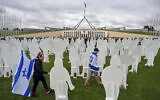 Supporters of Israel walk past cardboard cutouts representing Israeli hostages, during a protest outside Parliament House in Canberra, Australia, November 28, 2023. (Mick Tsikas/AAP Image via AP)