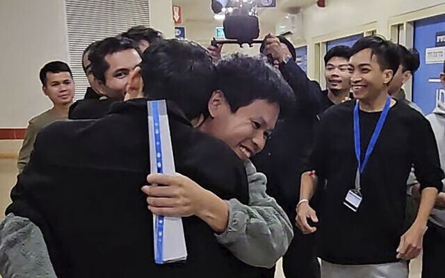 In this photo provided by Thailand's Foreign Ministry, Thai hostages, who were previously released, hug their newly-freed compatriots at the Shamir Medical Center in Israel, Nov. 28, 2023 (Thailand's Foreign Ministry via AP)