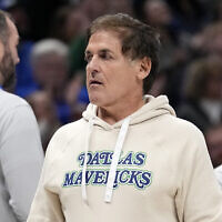 Dallas Mavericks team owner Mark Cuban walks to his seat during the first half of an NBA basketball game against the Houston Rockets in Dallas, November 28, 2023. (AP Photo/Tony Gutierrez)