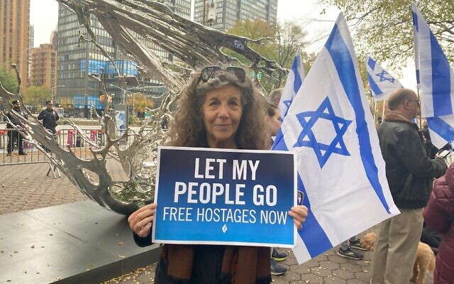 Charlene Frank, a Jewish American retiree who is now a full-time activist, holds a sign calling on Hamas to free hostages at a demonstration outside of the United Nations in New York City on behalf of hostages held in Gaza by Hamas terrorists, November 7, 2023. (Sarah Rosen)