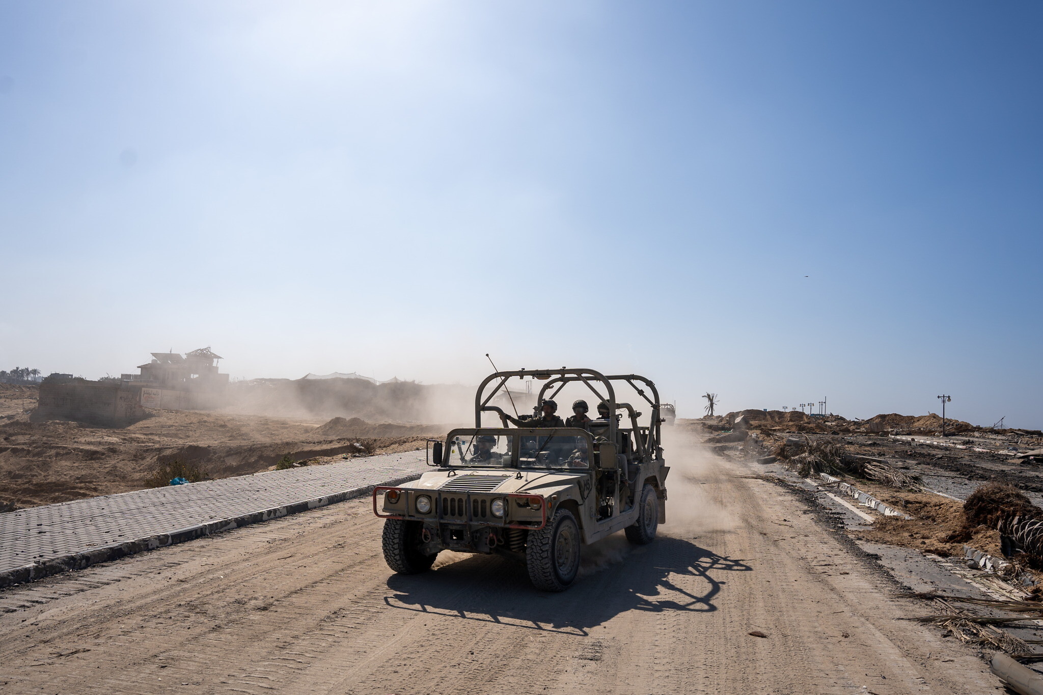 Troops are seen on the Gaza Strip's coastal road, November 7, 2023. (Emanuel Fabian/Times of Israel)