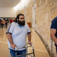 Mor Ganashvili, seriously injured during a mob assault in Acre in May 2021, arrives for a court hearing of one of his attackers at the Supreme Court in Jerusalem, May 17, 2023. (Yonatan Sindel/Flash90)