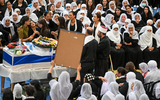 Family and friends of Lt. Col. Salman Habaka mourn at his funeral at the Druze village of Yanuh-Jat, northern Israel, on November 3, 2023. (Flash90)