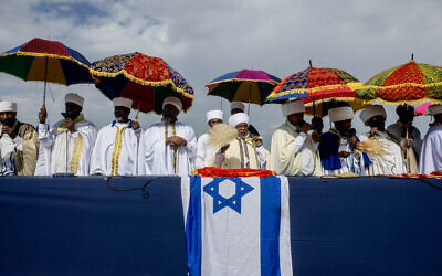 Ethiopian Jews take part in a prayer of the Sigd holiday on the Armon Hanatziv Promenade overlooking Jerusalem on November 13, 2023. (Chaim Goldberg/ Flash90)