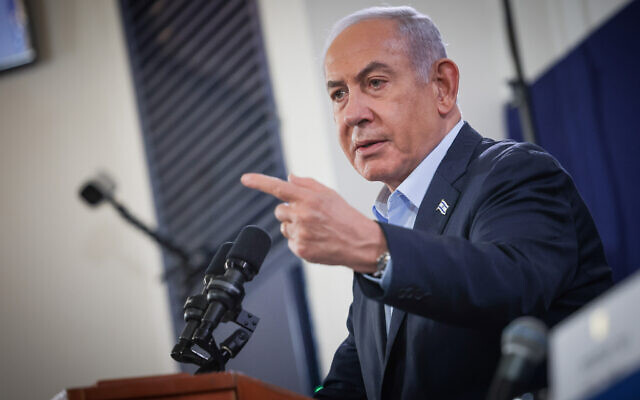 Prime Minister Benjamin Netanyahu speaks at a press conference at the Defense Ministry headquarters in Tel Aviv, November 22, 2023. (Chaim Goldberg/ Flash90)