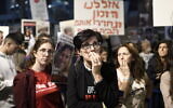 Israelis attend a rally calling for the release of Israelis held hostage in Gaza, in Tel Aviv, November 25, 2023. (Miriam Alster/Flash90)