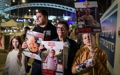Yocheved Lifshitz (center), who was freed in October from Hamas captivity, protests in Tel Aviv on November 28, 2023, alongside family members, for the release of the remaining hostages, including her husband, Oded. (Tomer Neuberg/Flash90)