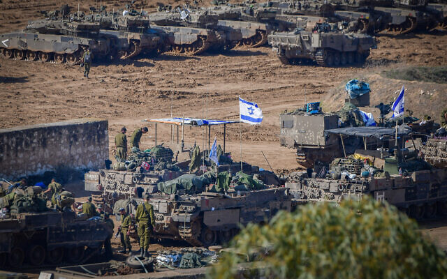 Israeli forces at a staging area near the border with Gaza on November 30, 2023. (Avshalom Sassoni/Flash90)